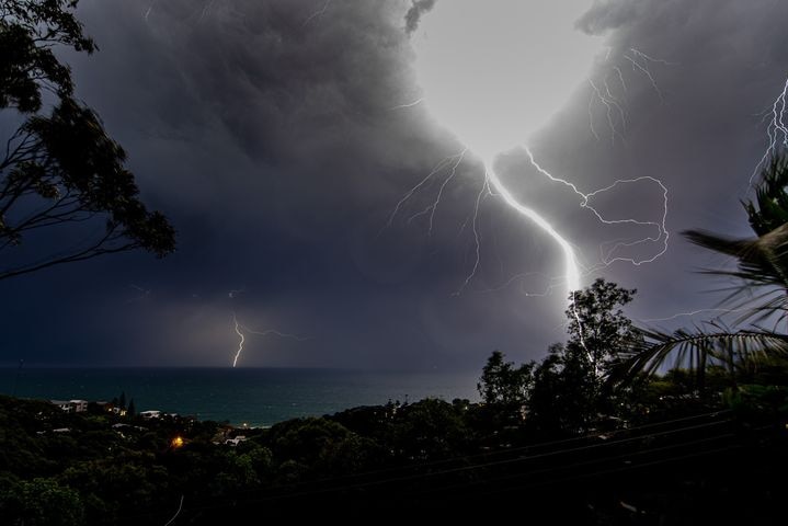 A lightning bolt strikes close to the camera.