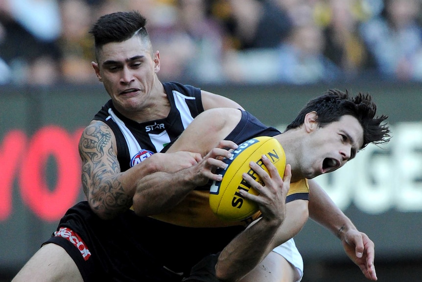 Trent Cotchin is tackled high
