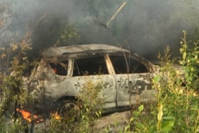 The burnt out car used by the teenagers