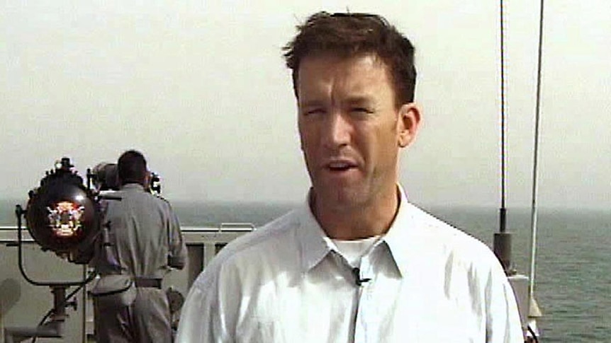 ABC cameraman Paul Moran aboard an Australian navy ship