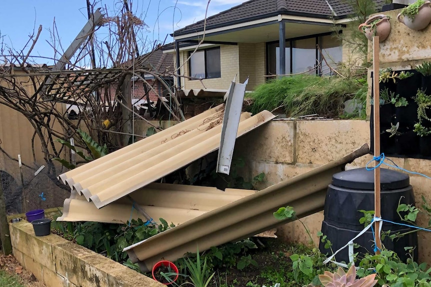 Fence fallen down into back garden.