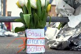 Flowers and a message left near scene of explosions.