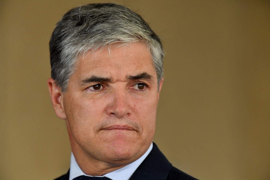 Katter's Australian Party Queensland leader Robbie Katter looks serious at a press conference in Brisbane.