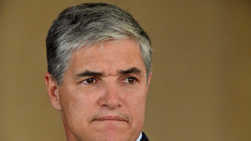 Katter's Australian Party Queensland leader Robbie Katter looks serious at a press conference in Brisbane.