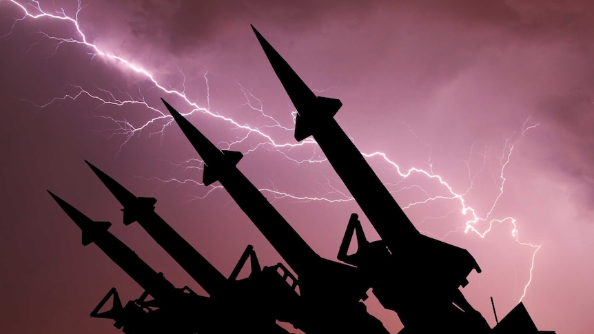 Anti-aircraft missile system are directed upwards against the background of thunderstorm