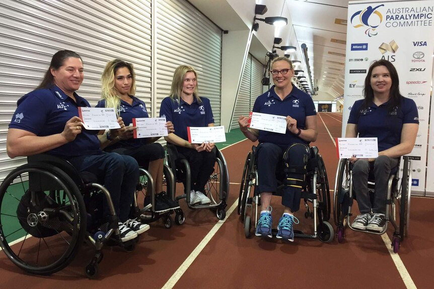 Some of Australia's Paralympians with their tickets to Rio.