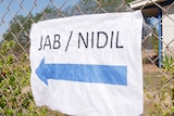 A paper sign says 'jab' and 'nidil' 