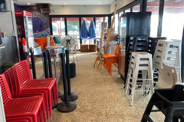 Chairs, stools, and umbrellas in a store