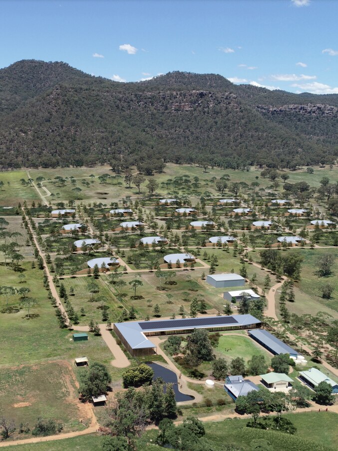 Aerial view of low-set buildings on a farm in the Hunter Valley.
