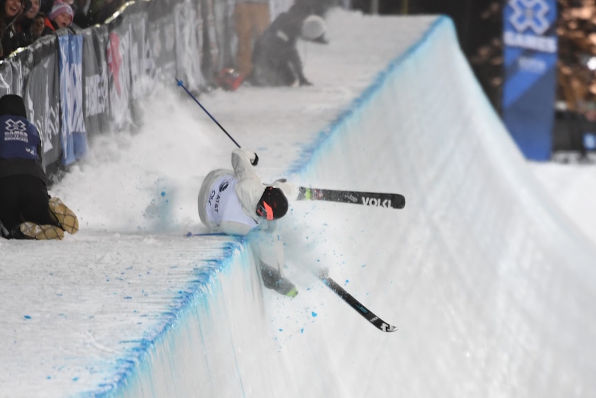 Kevin Rolland lands on the side of a half pipe