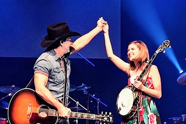 Taylor Pfeiffer on stage with Lee Kernaghan