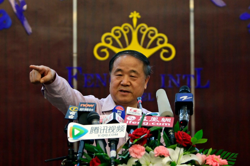 Chinese writer Mo Yan gestures during a news conference