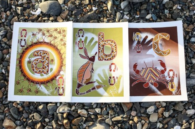 Three flash cards feature the alphabet letters A, B and C along with Indigenous artwork