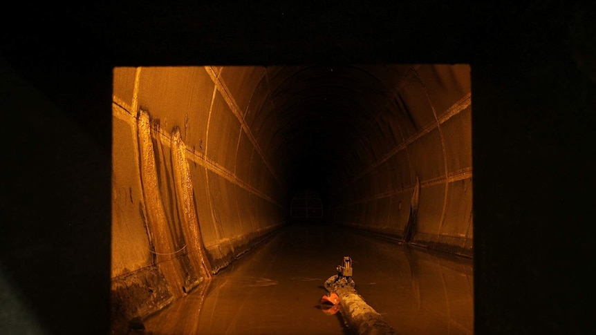 A photo of a well-lit cavernous oil tank.