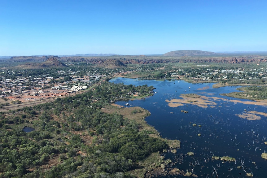 A view of Kununurra from the air, with blue skies.