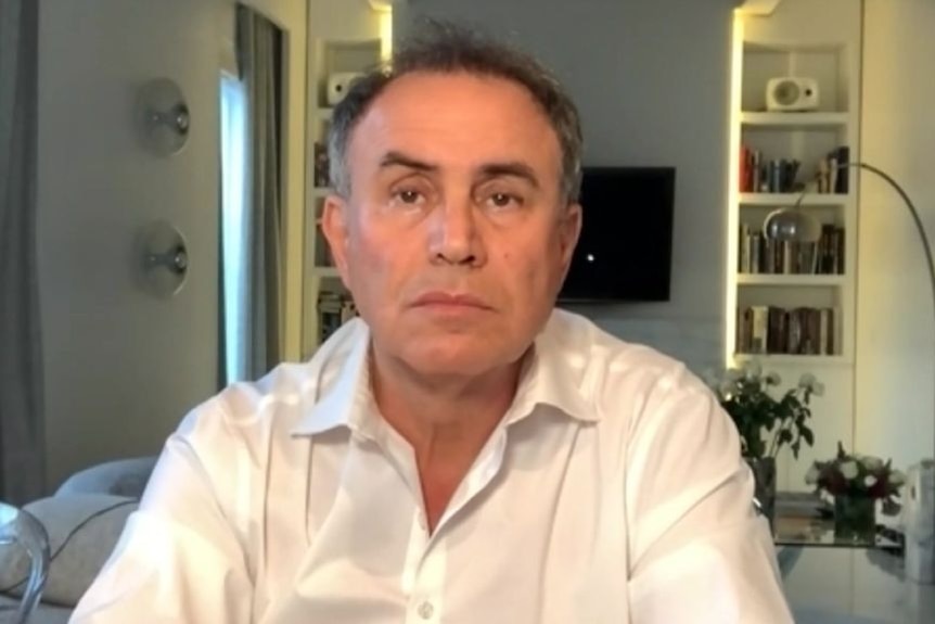 Nouriel Roubini sits in a room