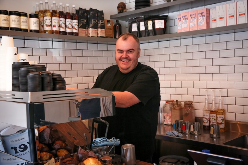 Michael Everett makes coffee at coffee shop in Orange 