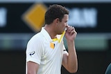 Josh Hazlewood leaves the field on day one of the second Test between Australia and India at the Gabba