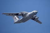 A Russian military plane flies in the sky at daytime