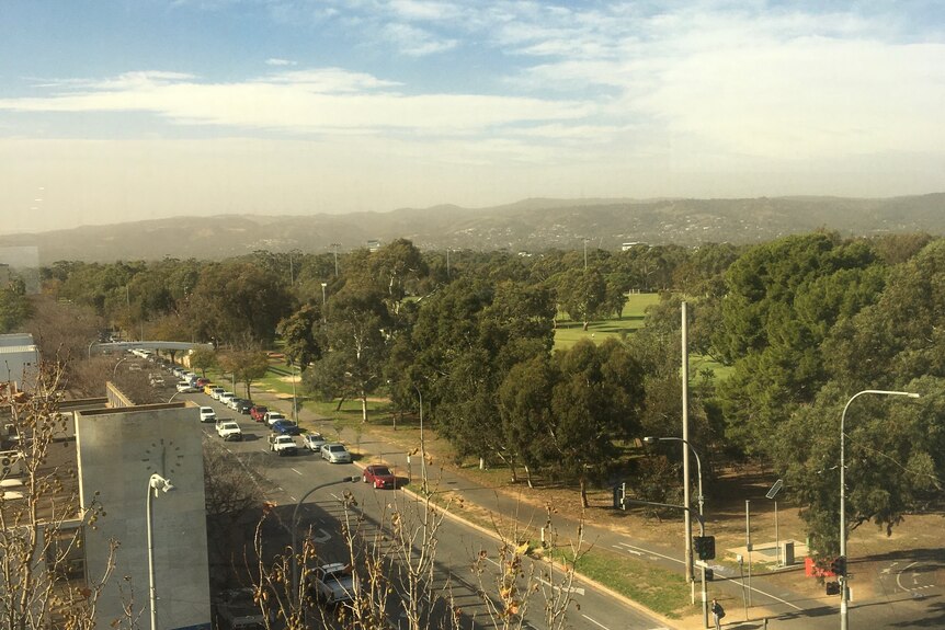 A strong dust haze obscures the view of the Adelaide Hills.