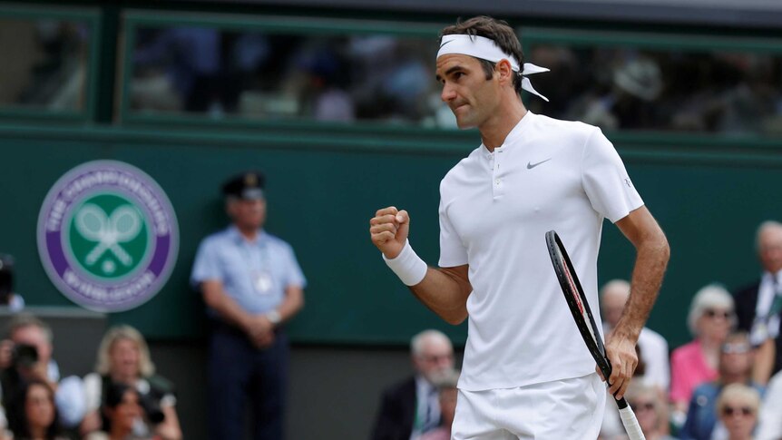Roger Federer pumps his fist during the Wimbledon final.