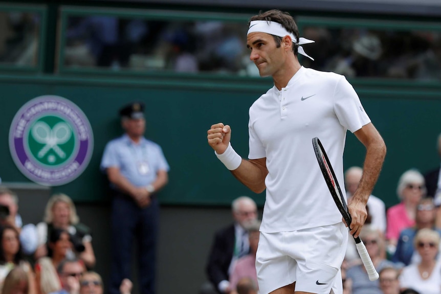 Roger Federer pumps his fist during the Wimbledon final.
