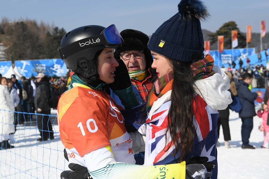 Belle Brockhoff hugs her sister after competing in the women's snowboard cross at the 2018 Olympic Winter Games.