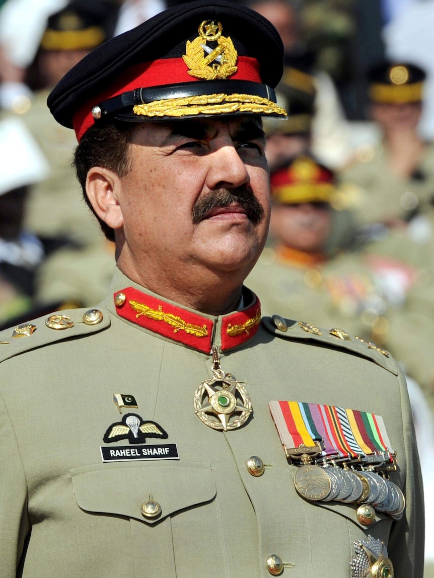 Pakistan's General Raheel Sharif stands to attention in full military uniform.