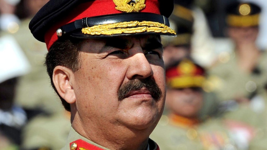 Pakistan's General Raheel Sharif stands to attention in full military uniform.