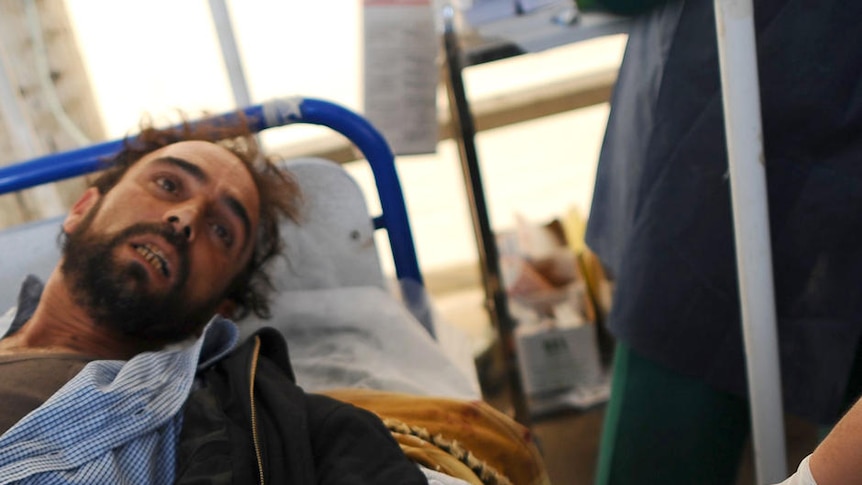 A wounded Libyan rebel receives medical treatment in Misrata