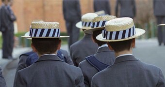 Male students in grey blazers and boater hats