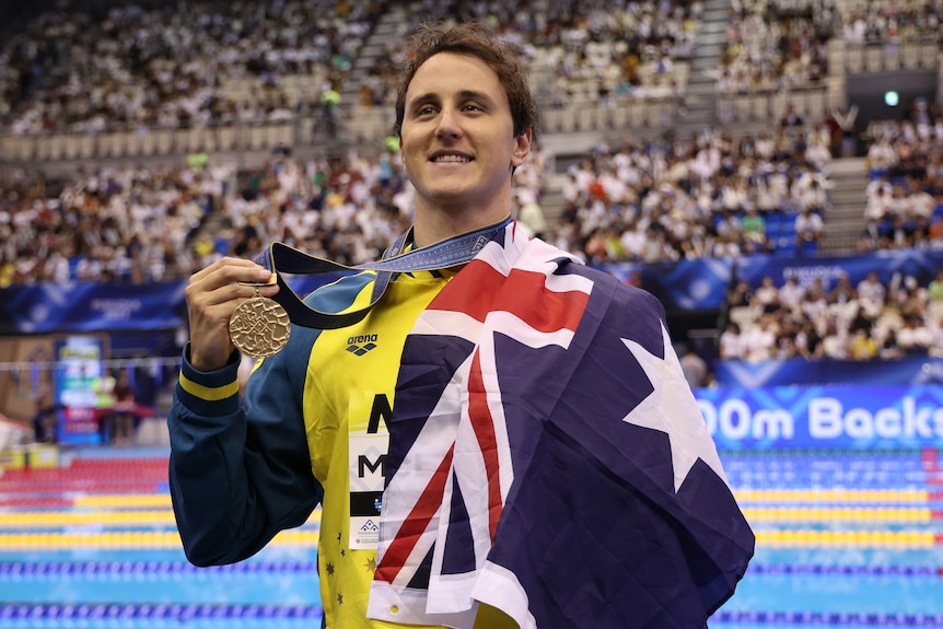 Cameron McEvoy holds a gold medal