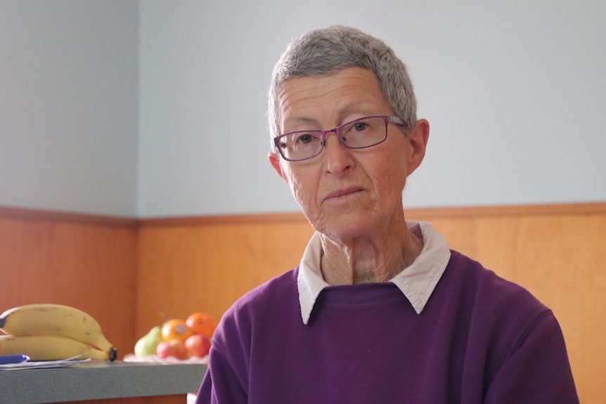 A woman sitting at the table.