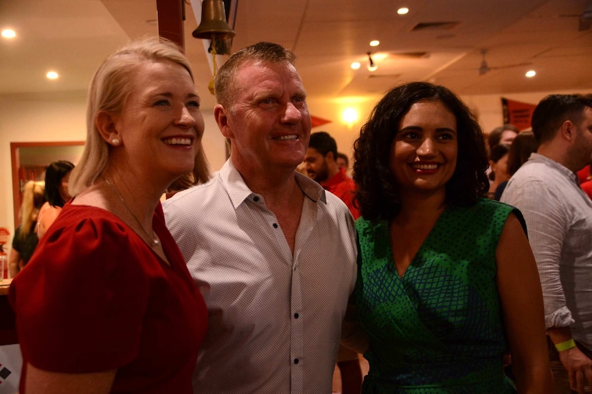 Labor MPs Nicole Manison, Paul Kirby and Lauren Moss celebrate at Labor Party headquarters on election night.