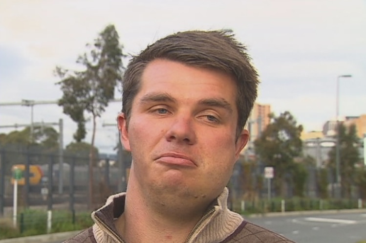 Suburban football player Carl Teusner with a badly swollen jaw.