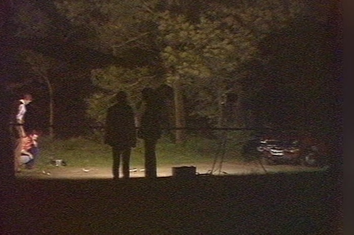 By night detectives examine the scene were Rodney Mitchell's body was found.