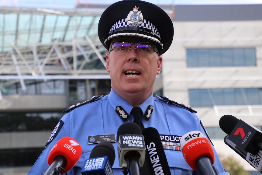 A mid shot of WA Police Commander Mike Bell speaking in front of a building where a roof collapsed at Curtin University.