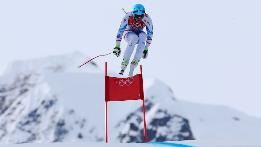 On a high ... Matthias Mayer  gets airborne on his way to winning gold