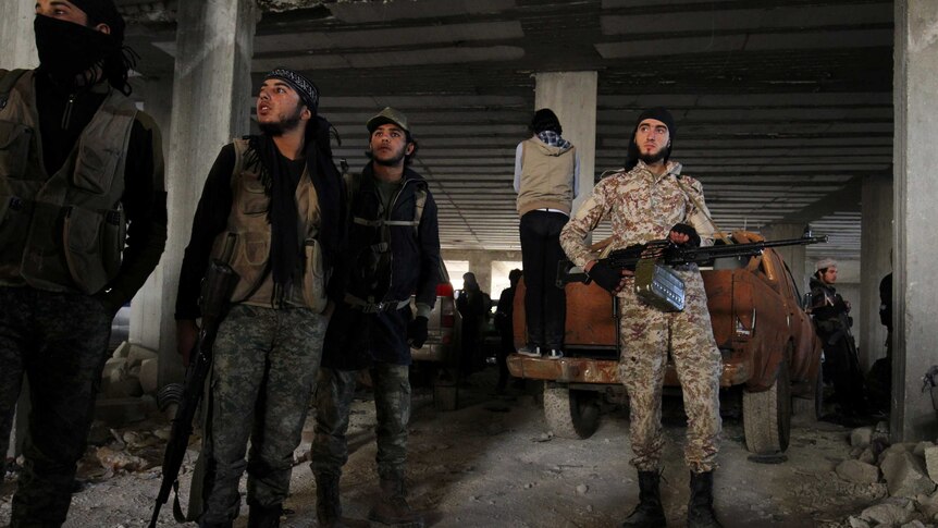 Rebel fighters in Aleppo