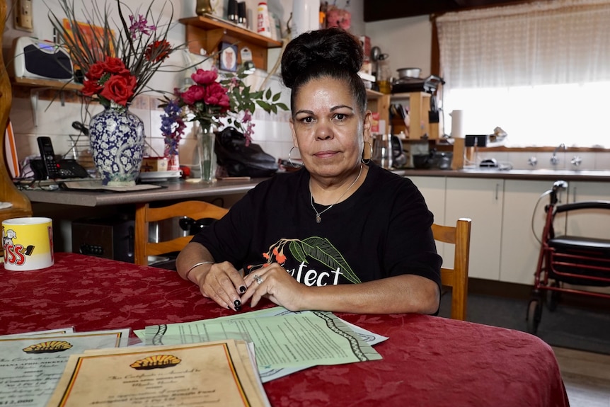 Nikki Foy sits at her kitchen table.