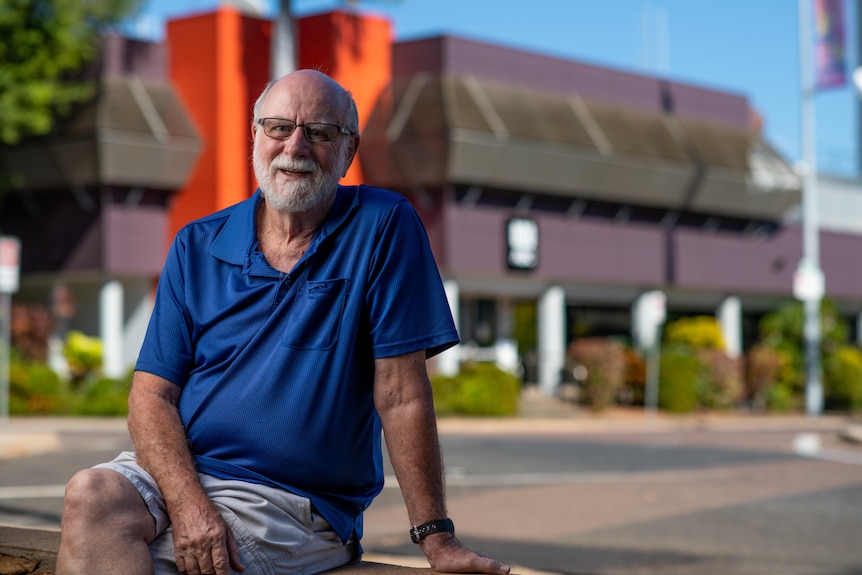 A photo of former ABC reporter Bill Fletcher. He has a grey beard and is wearing a navy blue collared T-shirt. 