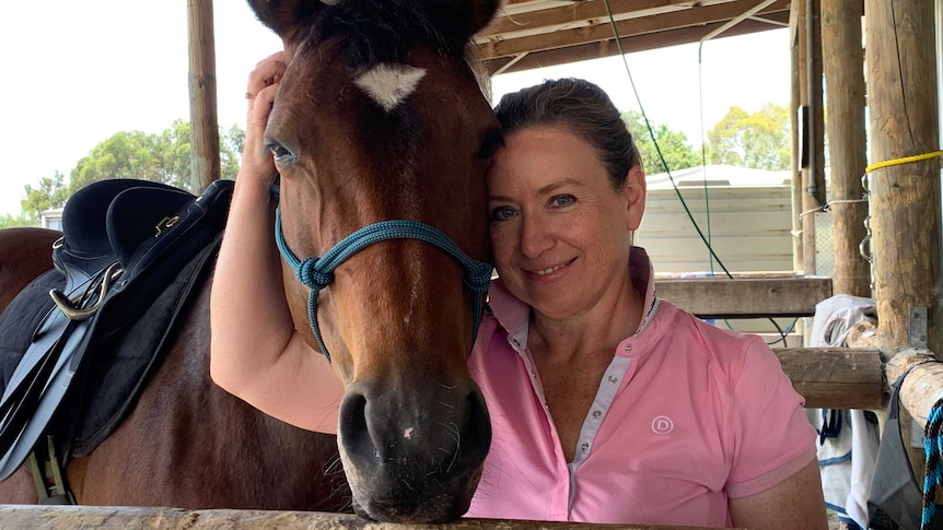 Natasha Johnson is now the owner of a 10-year-old mare named Reyn.