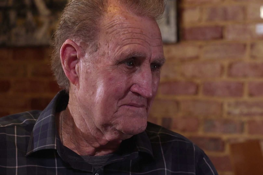 Close-up of abuse survivor Warren Porter sitting in a cafe