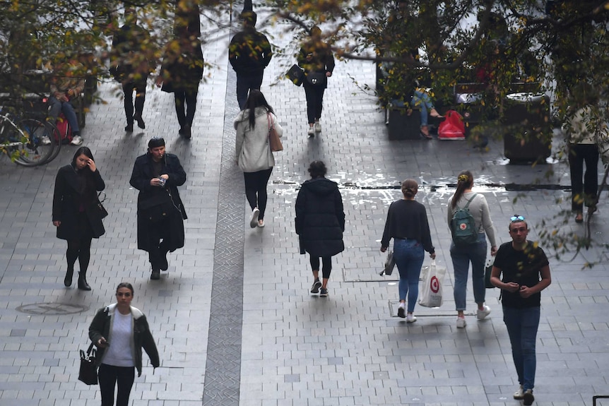 People are seen on a Sydney street.