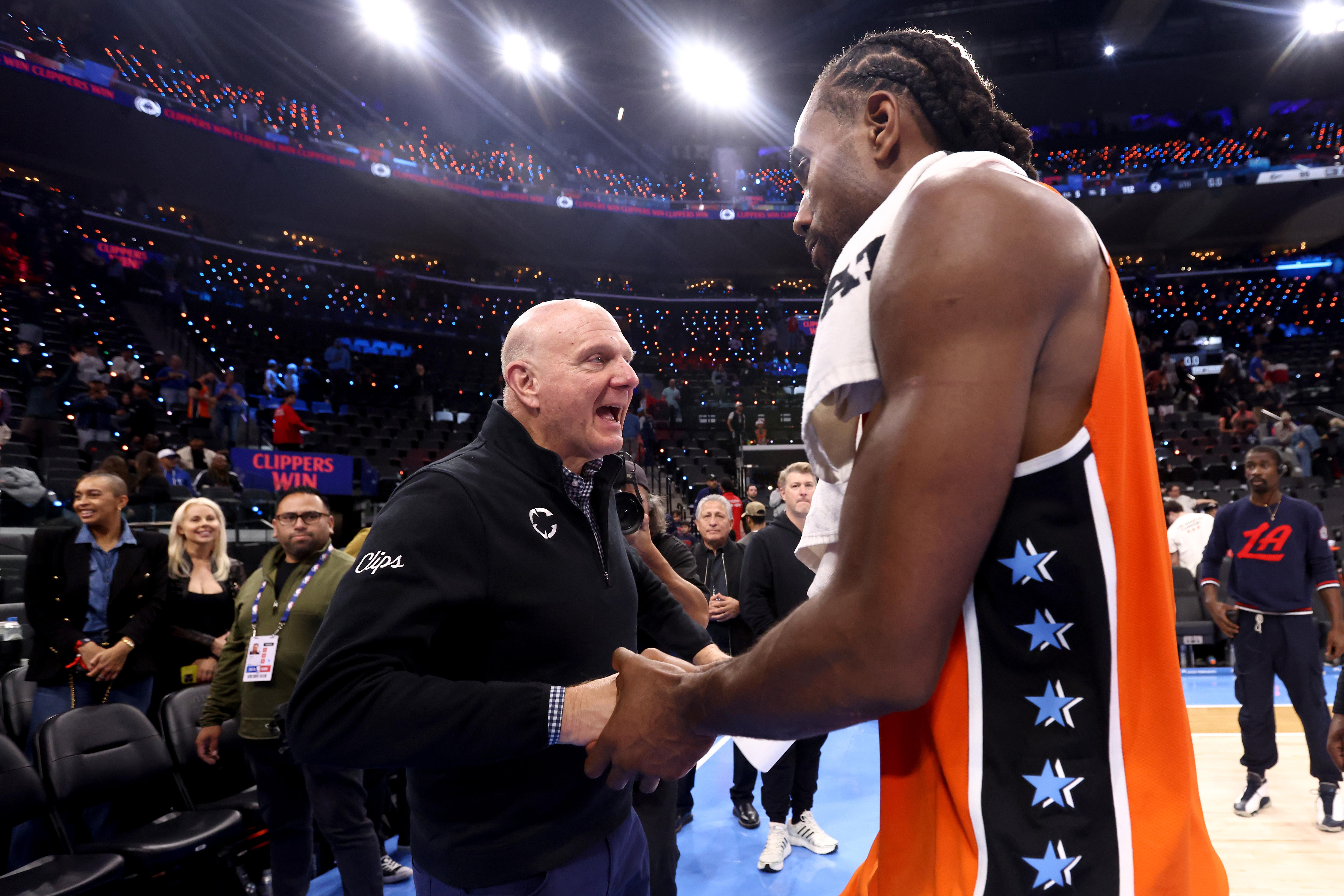 Steve Ballmer and Kawhi Leonard shake hands
