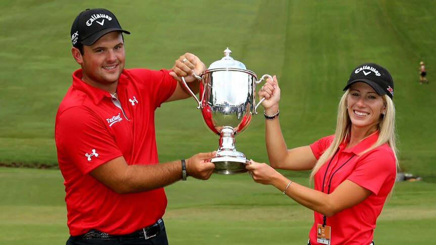 Patrick Reed with his first tour trophy