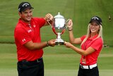 Patrick Reed with his first tour trophy