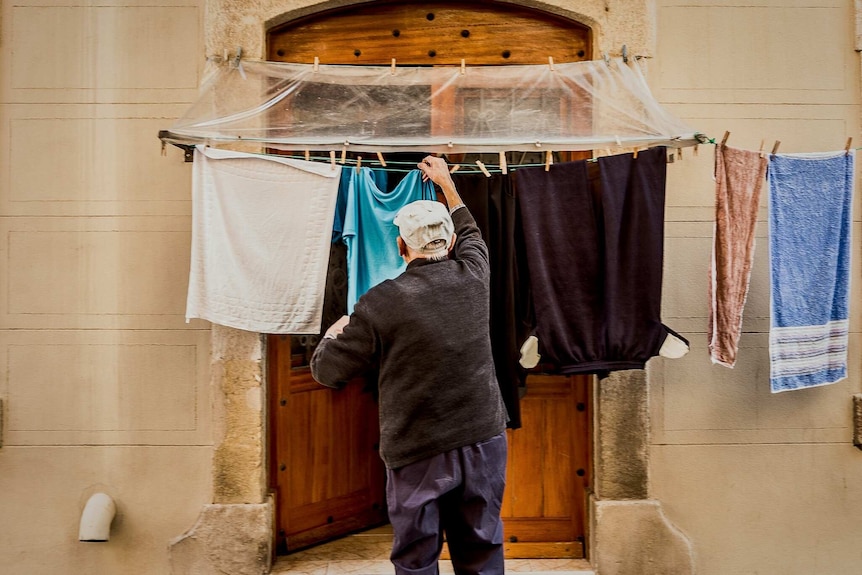 Man hanging washing
