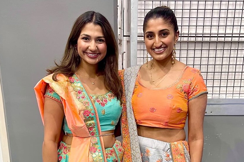 Two South Asian women dressed in traditional Indian clothing