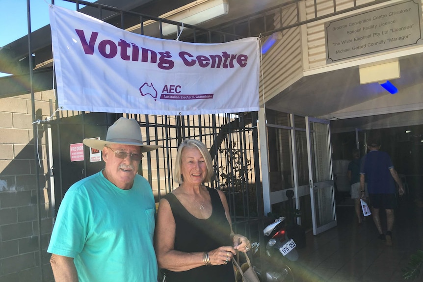 A man and woman outside a voting centre